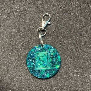 Blue “S” circle keychain $10